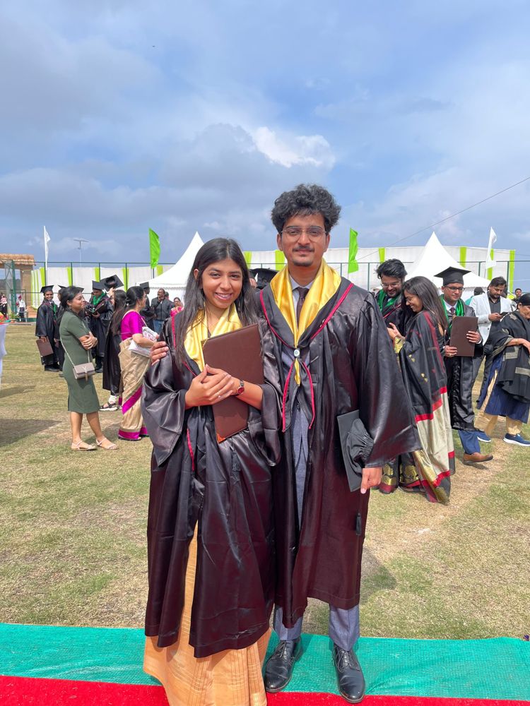 Urvish and Unnati in graduation robes